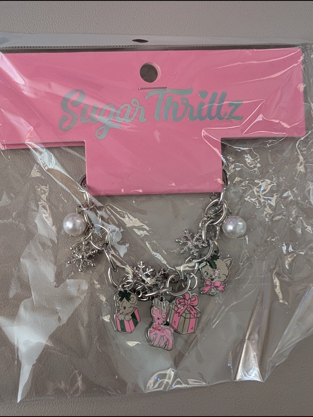Dolls Kill Sugar Thrillz Silver Charm Bracelet with Pink Enamel Accents